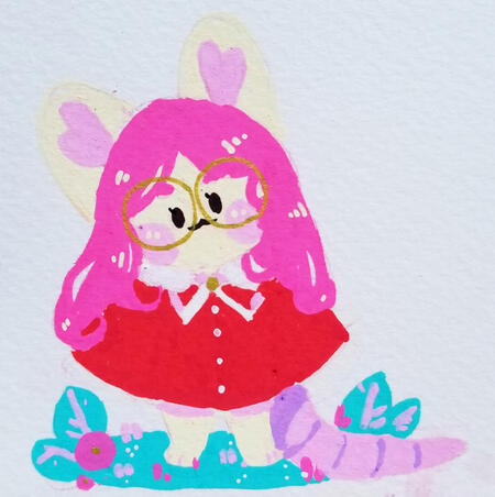 A round Phee standing in a little grass patch